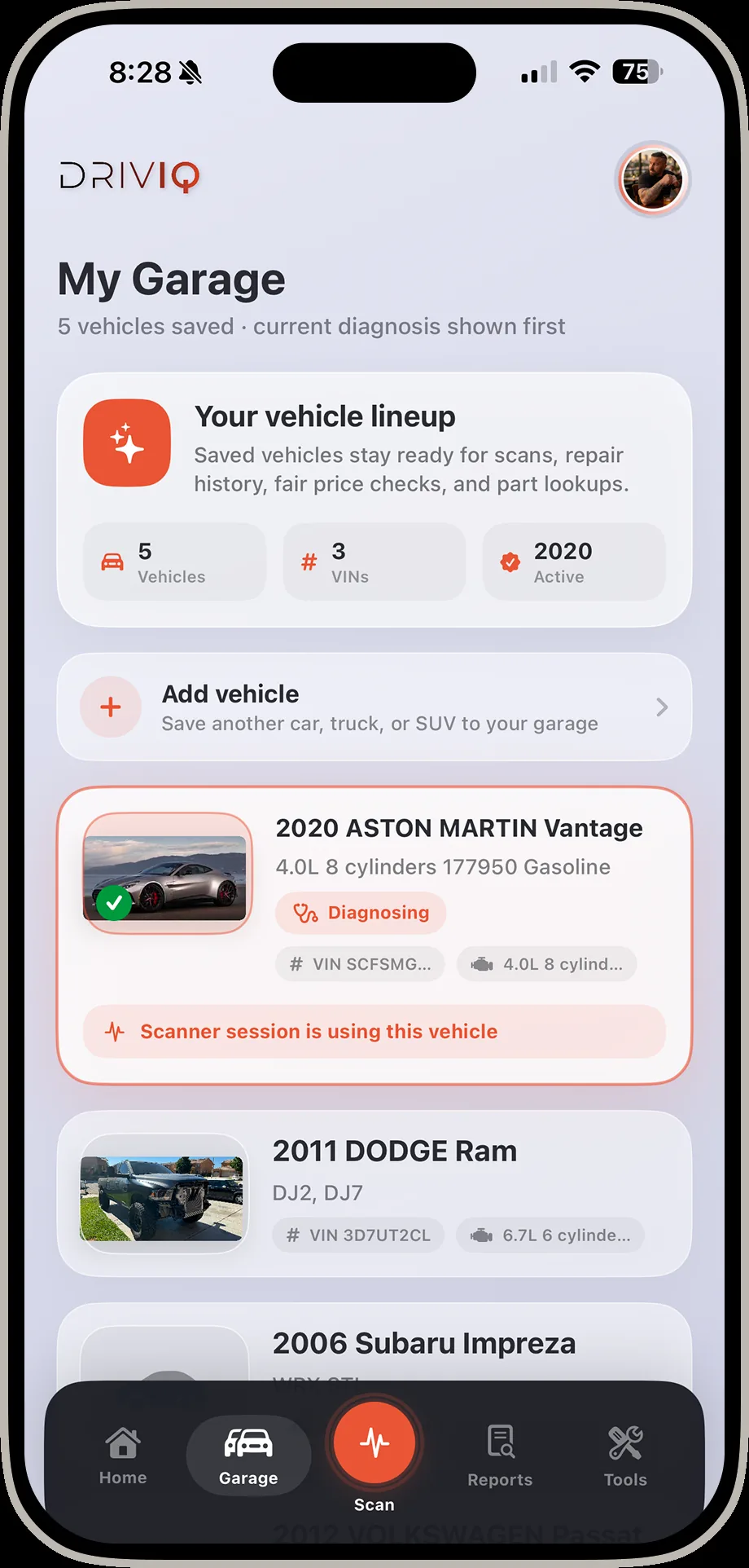DrivIQ garage screen listing five saved vehicles including an Aston Martin Vantage and a Dodge Ram